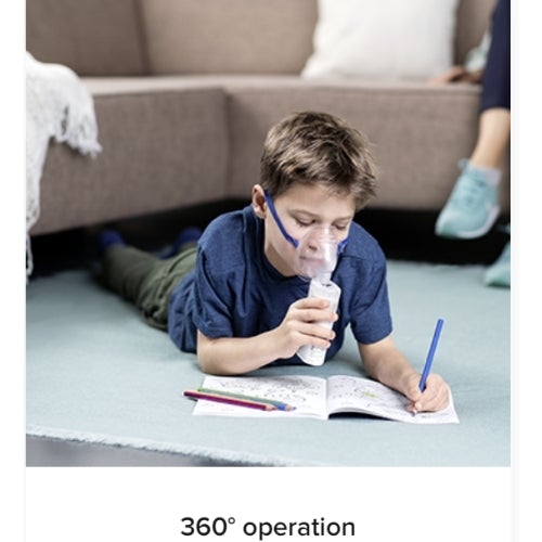 Omron MicroAir U100 Nebuliser young boy doing homework whilst using nebuliser